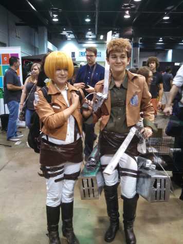 People cosplaying as the characters Armin and Jean from the anime and manga, "Attack on Titan." 