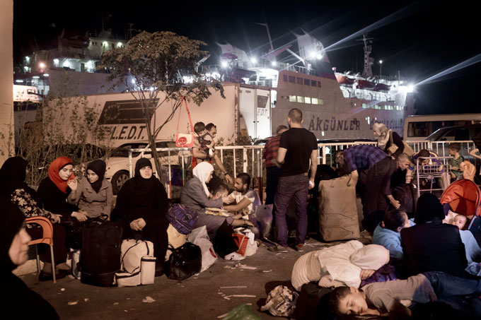 Syrian refugees at the port of Tripoli, Lebanon, waiting to board the ferry Lady Su, which travels to Tasucu,Turkey, in a twelve-hour journey. The ferry, which was scheduled to depart at 10 p.m. on September 21, left the port at 10 a.m. the following day due to regular delays and an truck accident during loading. 
