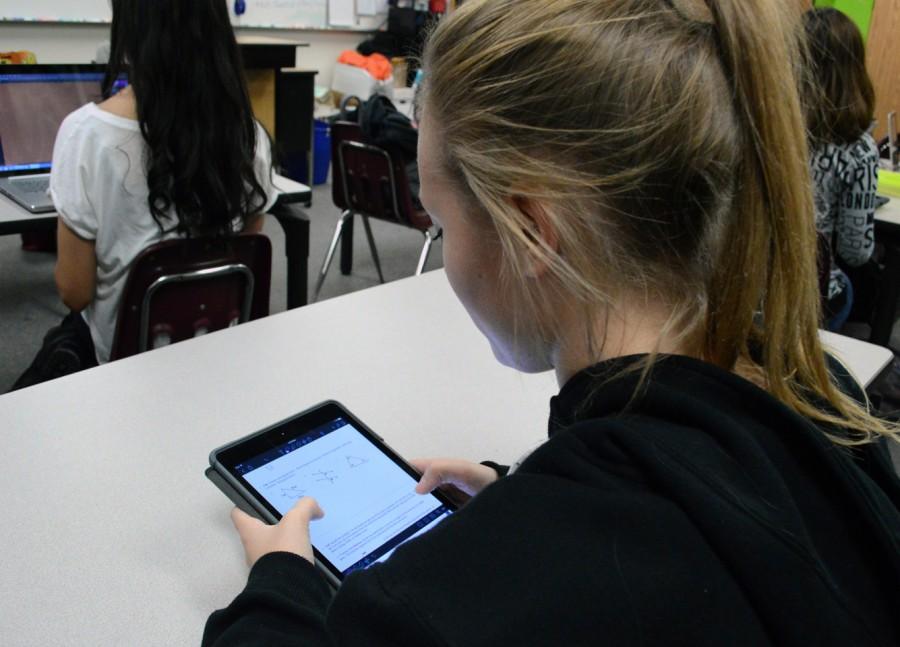 Freshman Cheyenne Voorhies works diligently on her iPad.