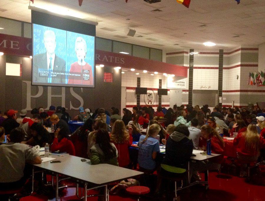 Students play debate bingo as they watch Clinton and Trump face off.