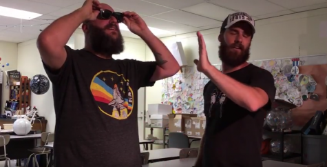 Palatine High school teacher Sean Fisher-Rohde and Hoffman Estates science teacher Tyler Michie demonstate the saftey of wearing the glasses for the solar eclipse event.