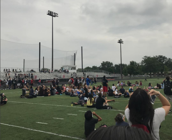 PHS students peek through clouds to watch the solar eclipse.