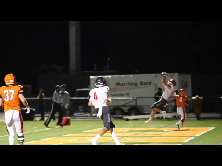 Johnny OShea, #80 in white, catches a touchdown against Evanston.