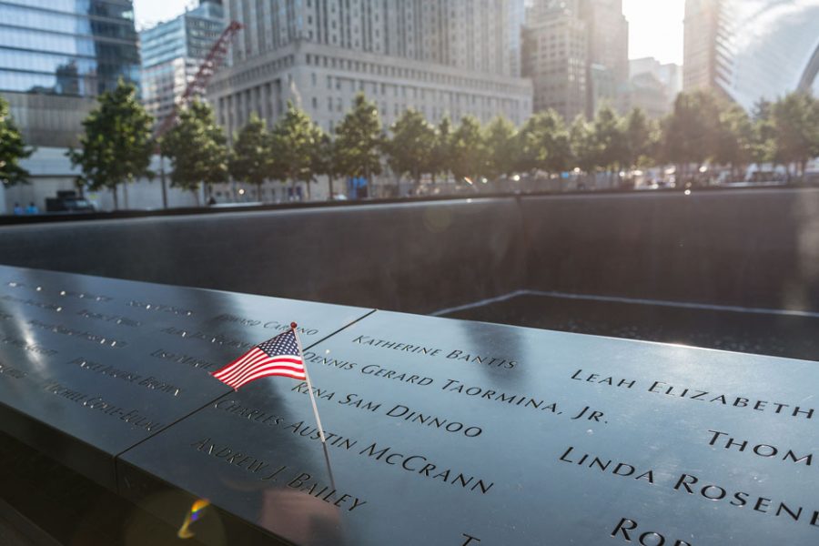 The name of a victim of the 9/11 attacks is seen adorned an American flag on the perimeter of a reflecting pool at a ceremony commemoratoing the 16th anniversary of the September 11th terrorist attacks at the World Trade Center site in New York, New York, NY, USA on September 11, 2017
