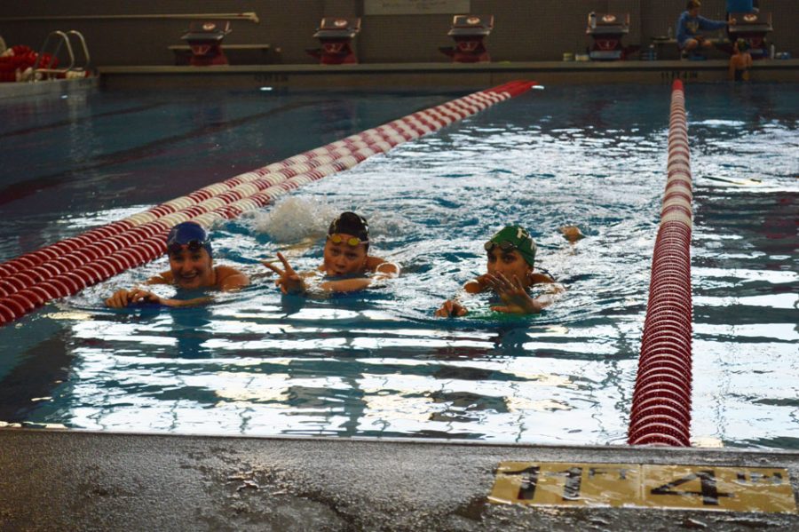 Megan Obernesser (19), Jane Smith (20) and Ola Gorecki (22) practice in preparation of the long swim season.