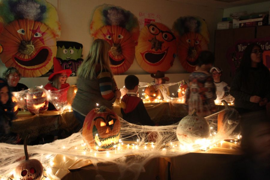 Different clubs, activities and teams decorate rooms with different themes like this walk of jack-o-lanterns.
