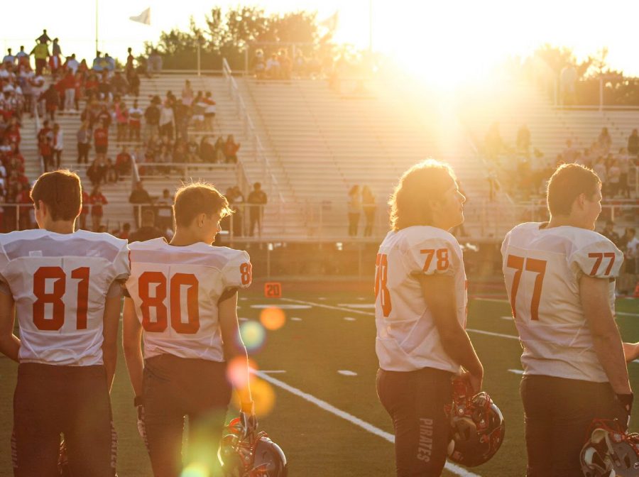 The sun is shining down on the boys, a beautiful day for football.