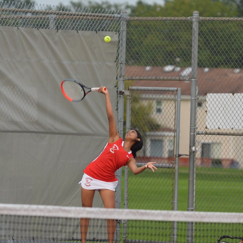 Senior Anishita Jayanth, one of the leaders on the team, practices her serve.
