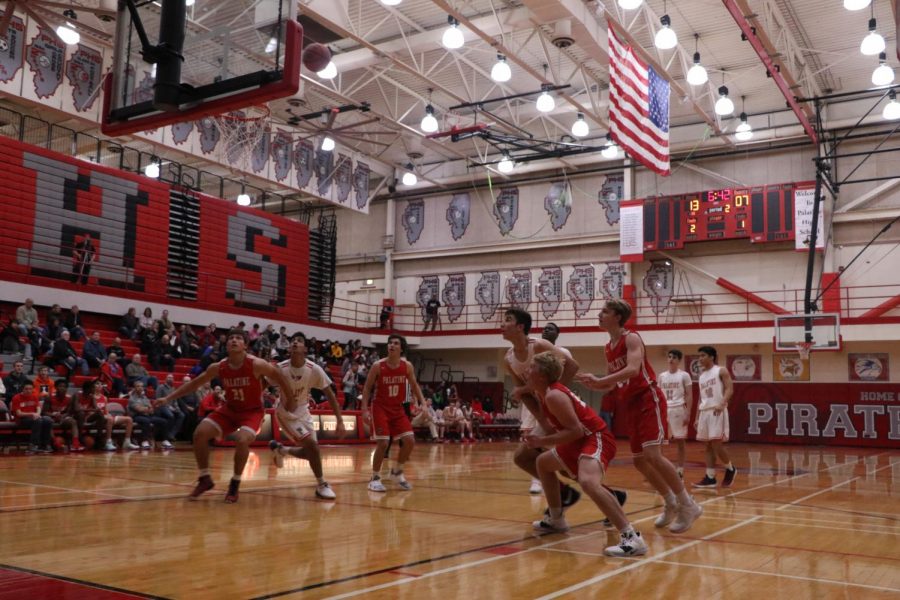 The Boys varsity basketball team compete against each other at the Red and White game.