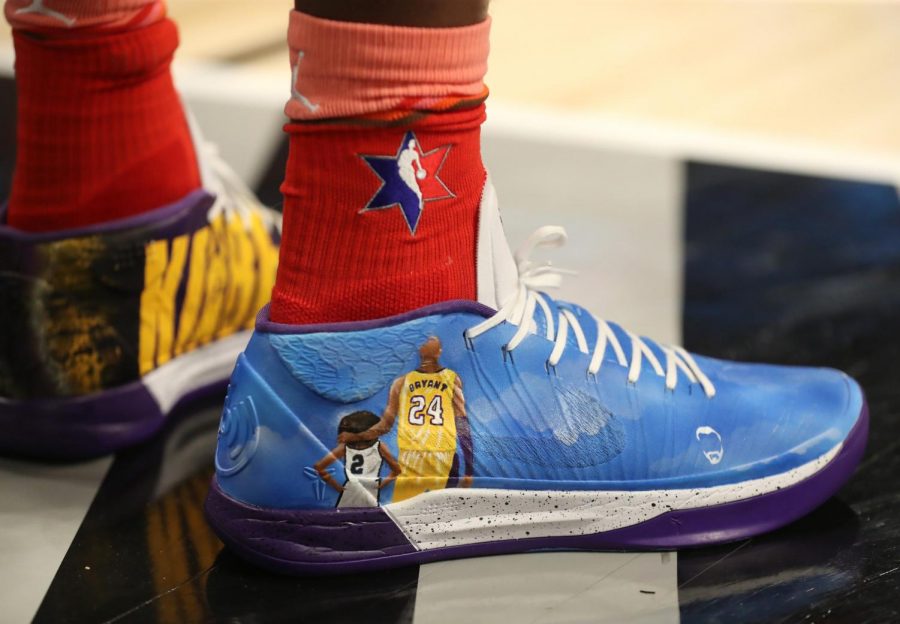Bam Adebayo of Team Giannis wears custom-decorated shoes depicting the likeness and name of Kobe Bryant and his daughter Gianna in the fourth quarter of the NBA All-Star Game.