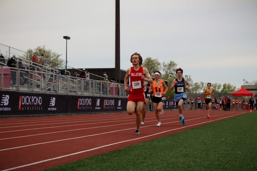 Andy Hansen runs in the boys 1600 meter with a time of 4:45.39
