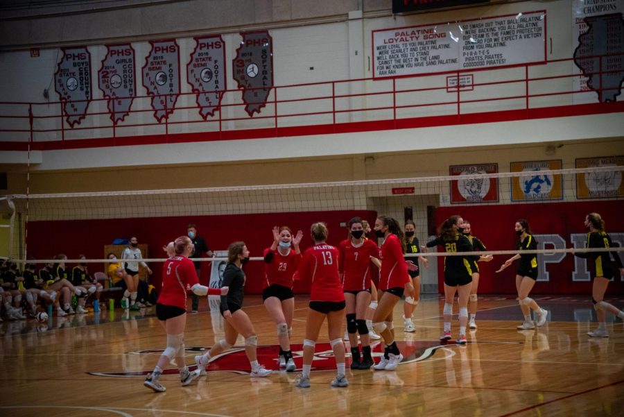 The team celebrates a comeback against Fremd late in the second set.