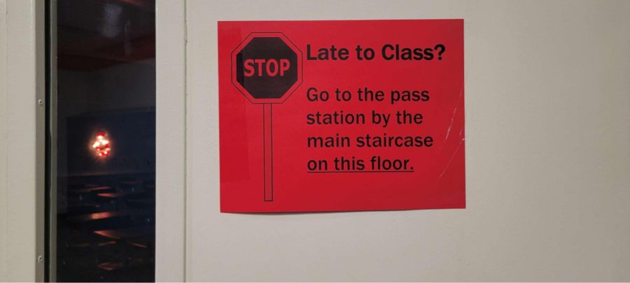 Signs+outside+classroom+doors+direct+students%2C+who+are+late%2C+with+instructions+to+go+to+the+pass++station.+