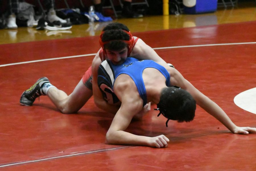 Palatine High School Pirates falls to the Conant High School Cougars in a competitive wrestling match on Dec. 10. This photo is from a wrestling tournament held at PHS on Dec. 4.