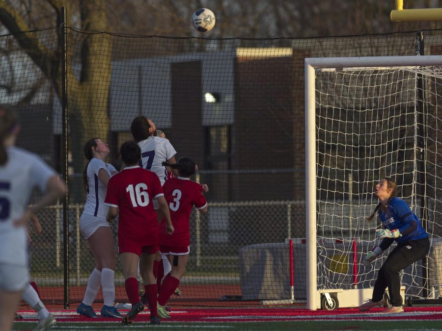 Kate Latek, along with the defensive team, prepares to stop the ball from entering the PHS goal.