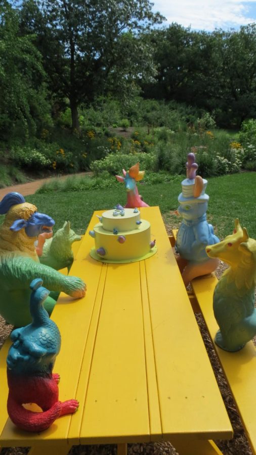 Birthday Party by Gail Simpson and Aristotle Georgiades references many modern day fantasy stories as imaginary creatures sit themselves at the yellow table.