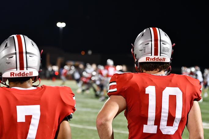 Dominick Ball (7) and Nate Branch (10) watch as the Palatine defense shut down the Buffalo Grove offense during a 50-7 win.