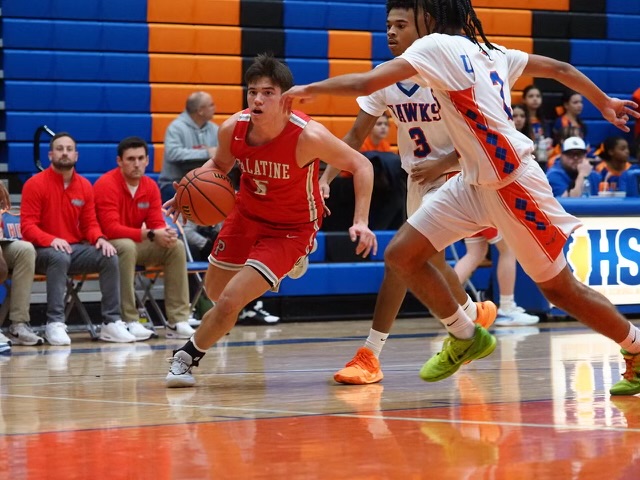 Senior player Sam Millstone dribbles in for a lay up against Hoffman Estates. 