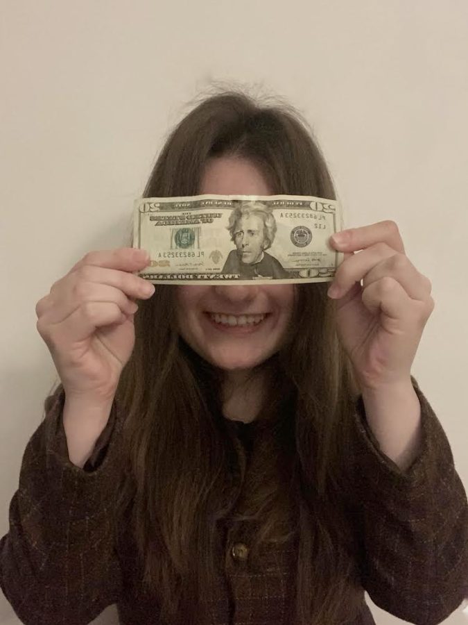 PHS student, Sonia Jezierski, admires her twenty-dollar bill and the joy it brings her.