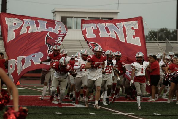 The red/white scrimmage marks the beginning of the new football season. Im looking forward to spending time with my teammates, Varsity football player Connor May said. My teammates always bring tons of energy and enthusiasm to games creating a competitive and fun environment.
