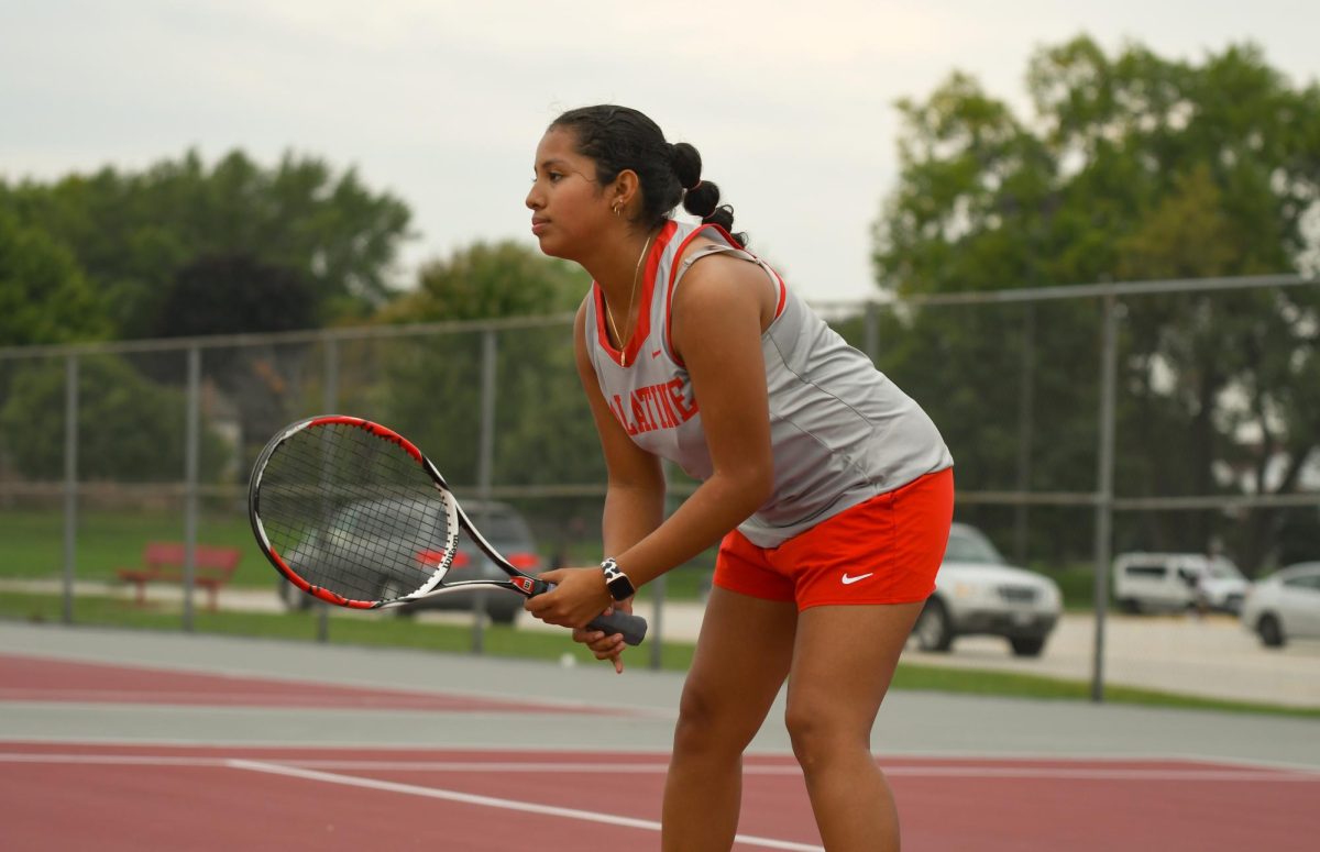 Sophomore Emily Segovia readying herself to counter the opponents serve. 