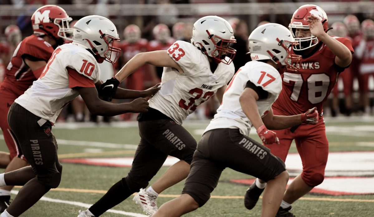Linebacker, Vince Bowling (33) running to make a tackle on Maine South’s offense.