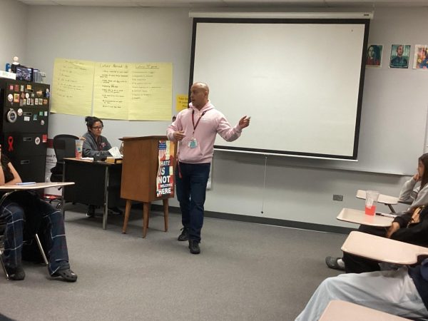 Spanish teacher Gustavo Correa talks about his life experiences to a Spanish for Native Speakers class.