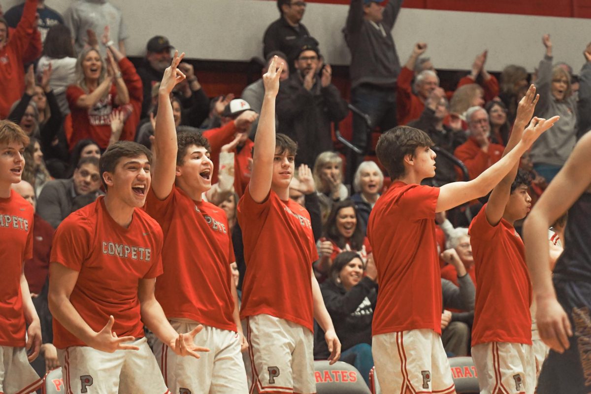 Parents, the team, and student section brought an enthusiastic environment as they supported the members on the court.