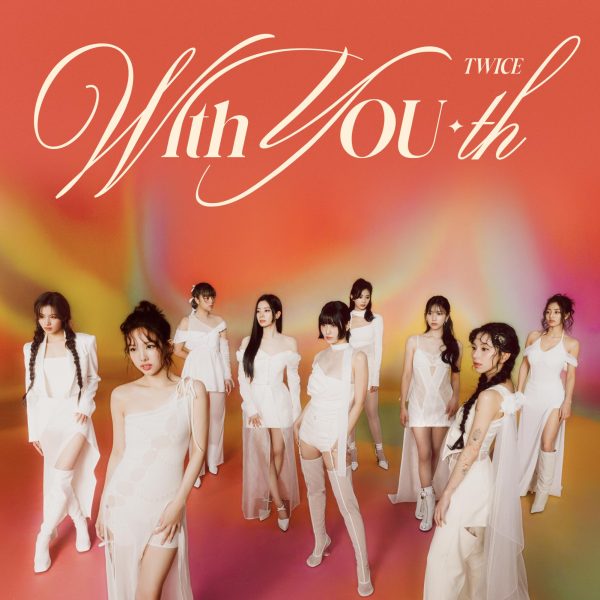 The nine members of Twice pose for the cover of ‘With You-th’. 