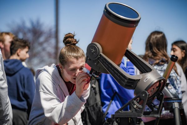 Astronomy teachers provided telescopes outfitted with solar filters for students to witness the eclipse up close.