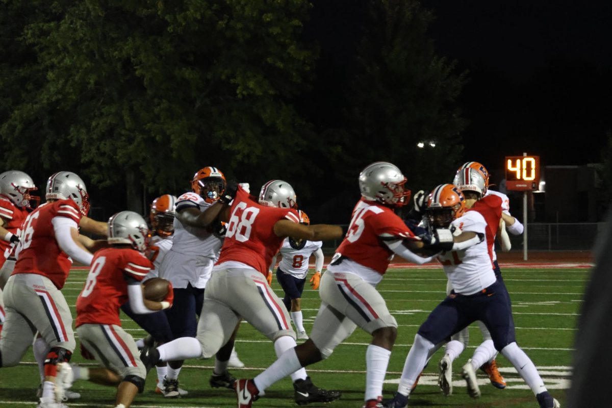 Palatine football's defense protects the football efficiently. 