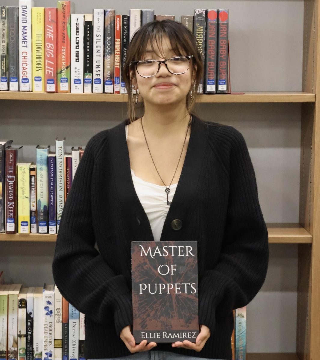 Ellie Ramirez poses with her debut novel.