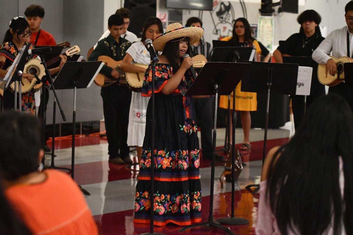 The mariachi club entertains the community in the PHS cafeteria.