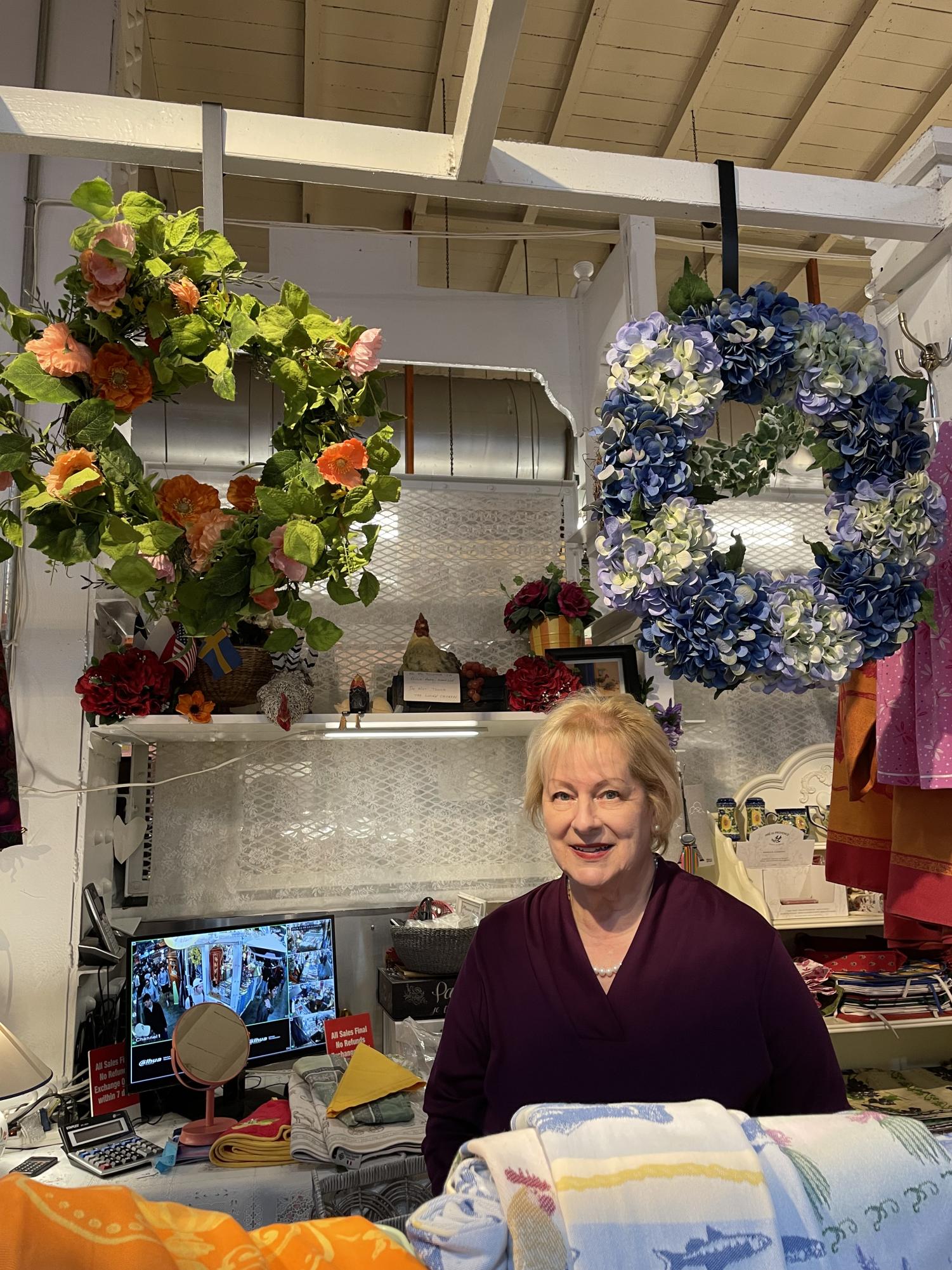 Laura DiFrancesco, the owner of Contessa's French Linens, sells imported European fabrics at the Reading Terminal Market. 