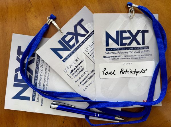 The NEXT - Talks For The Future Generation lanyard with information on who is speaking and what universities are present. 