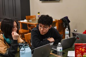 Angel Duong, a junior in AP Computer Science A, explains the intricacies of her game to Bilguun Javkhlan, a sophomore taking Intro to Computer Science.