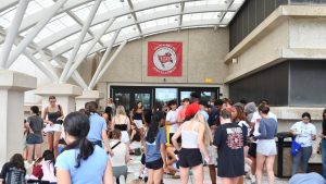 Palatine's seniors gather at the main entrance to participate in the annual tradition of signing their names in chalk. This year is PHS's 150th anniversary.
