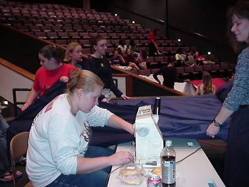Palatine students and teachers used sewing machines in the auditorium and later in the gym to sew a U.S. flag after the 9/11 attacks.