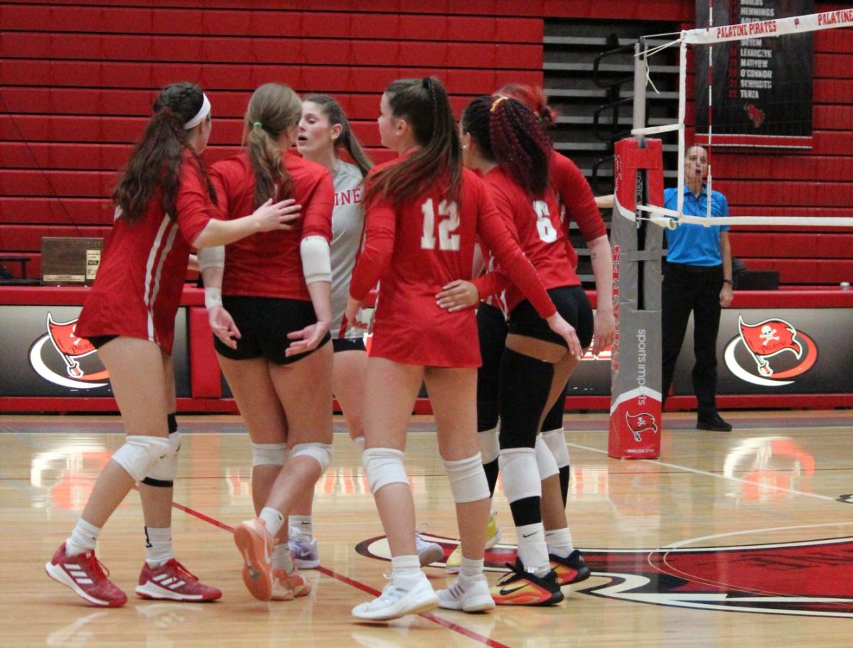 PHS girls volleyball team rallies following the end of a play