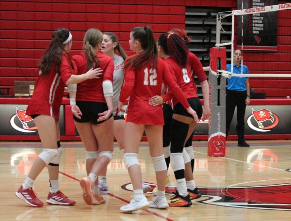 PHS girls volleyball team rallies following the end of a play