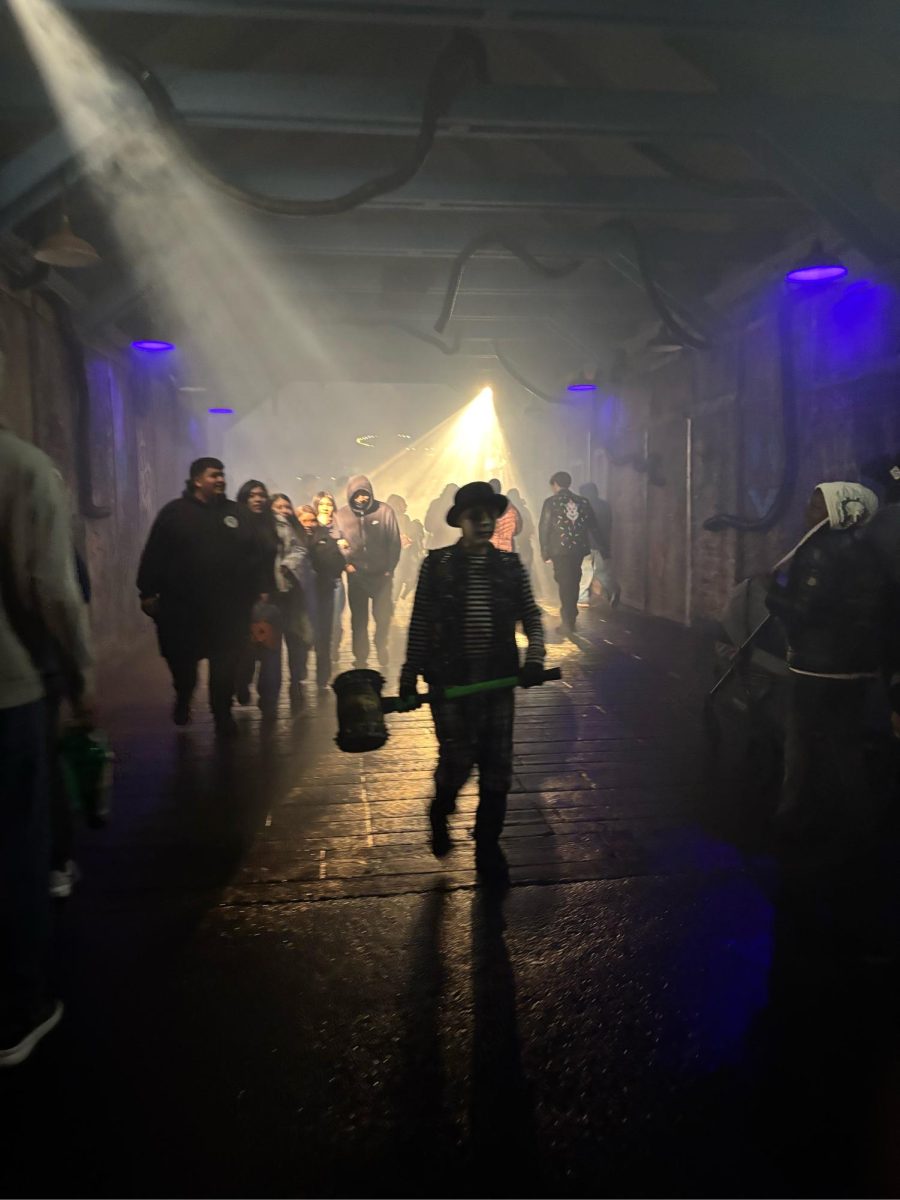 A scare actor walks in the "Henchman Alley" scare zone ready to scare unsuspecting passersby. After 6 p.m., Fright Fest begins and scare actors roam the park in certain areas. Each actor is a part of a theme and has a unique costume design.