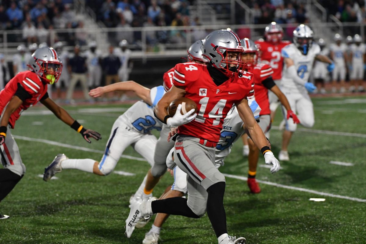 Senior Kole Fager returns a kickoff against Prospect High School.