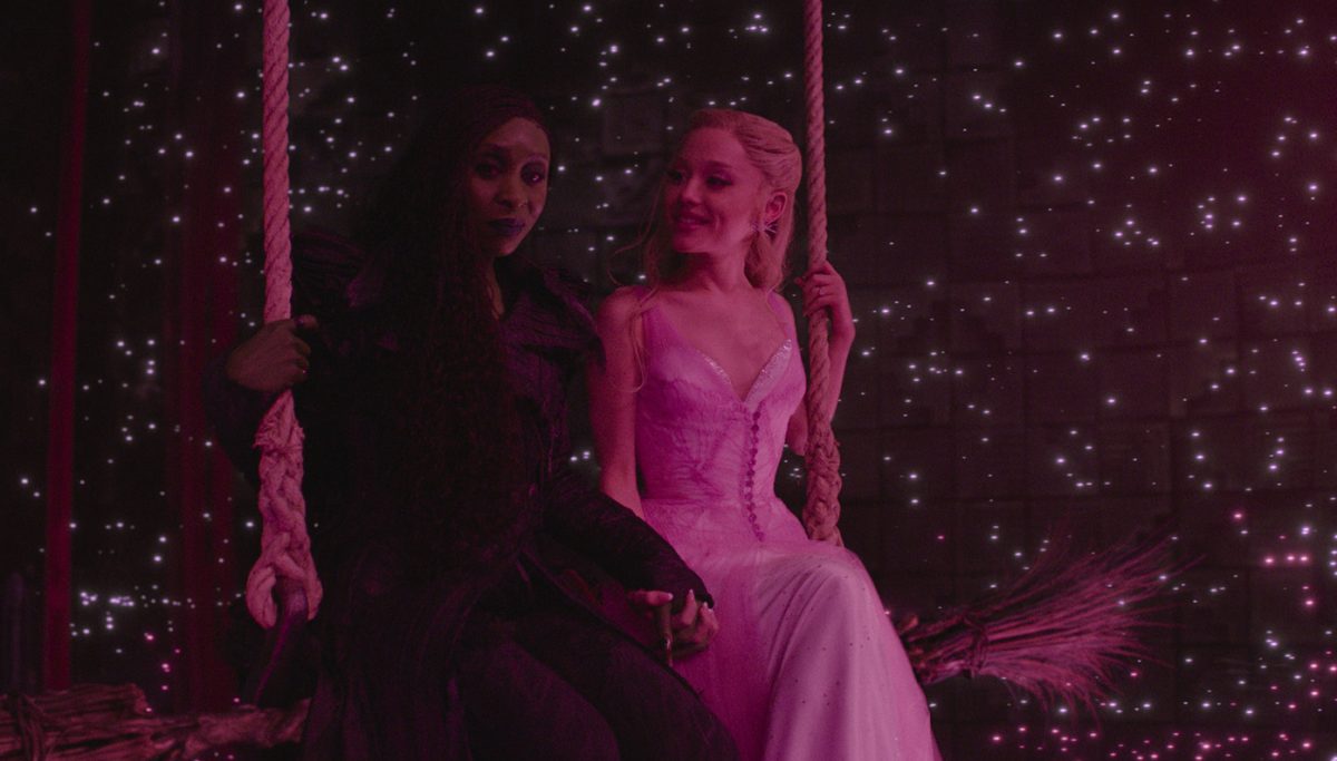 (L-R) Elphaba (Cynthia Erivo) and Glinda (Ariana Grande) sit together in "Wicked: For Good." The film was released by Universal Pictures on Nov. 21, marking the finale of the "Wicked" film duology. (Courtesy of Universal Pictures)