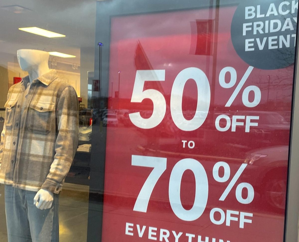 A Black Friday sale sign advertises deep discounts in the window of Express Factory Outlet at the Shops at Kildeer.
