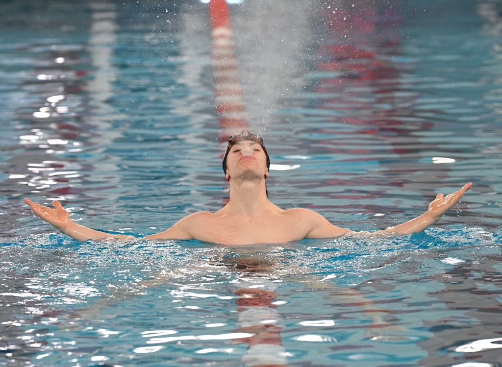 Hilgers sends a spray of water into the air during a drill at practice as he works toward his goal of qualifying for state.