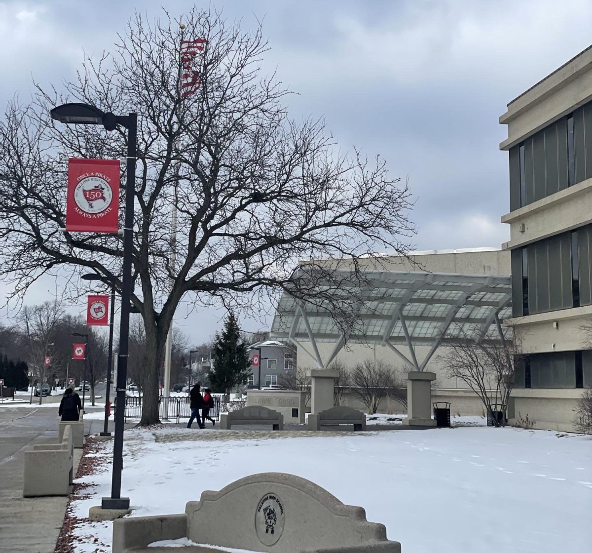 Snow coats Palatine High School amid talks of potential cold-day school closures.