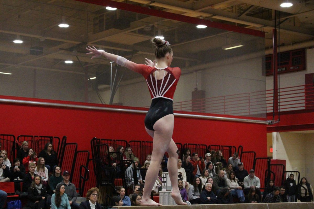 Senior Jolee Waddington starts her balance beam routine duing Palatine v Fremd.