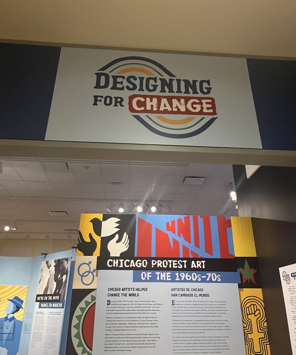 Entrance of “Designing for Change” exhibit featuring various pieces of protest art.