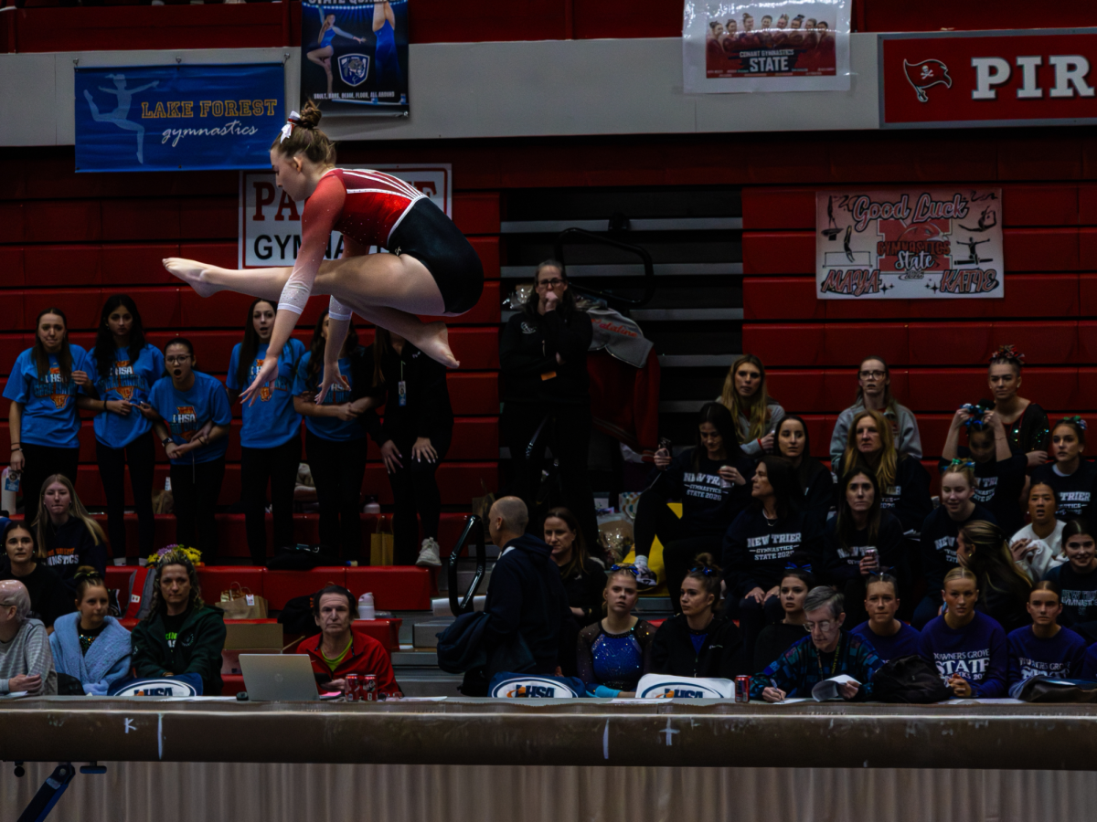 All-around State Champion Jolee Waddington competing during the beam event.