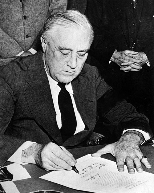 President Franklin D. Roosevelt signs a declaration of war against Japan on Dec. 8, 1941, the day after Pearl Harbor. 

Public Domain, National Archives and Records Administration (NARA)